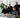 Vier E-Mail Marketing Experten sitzen vor laptops und planen Strategien für Klaviyo und Shopify